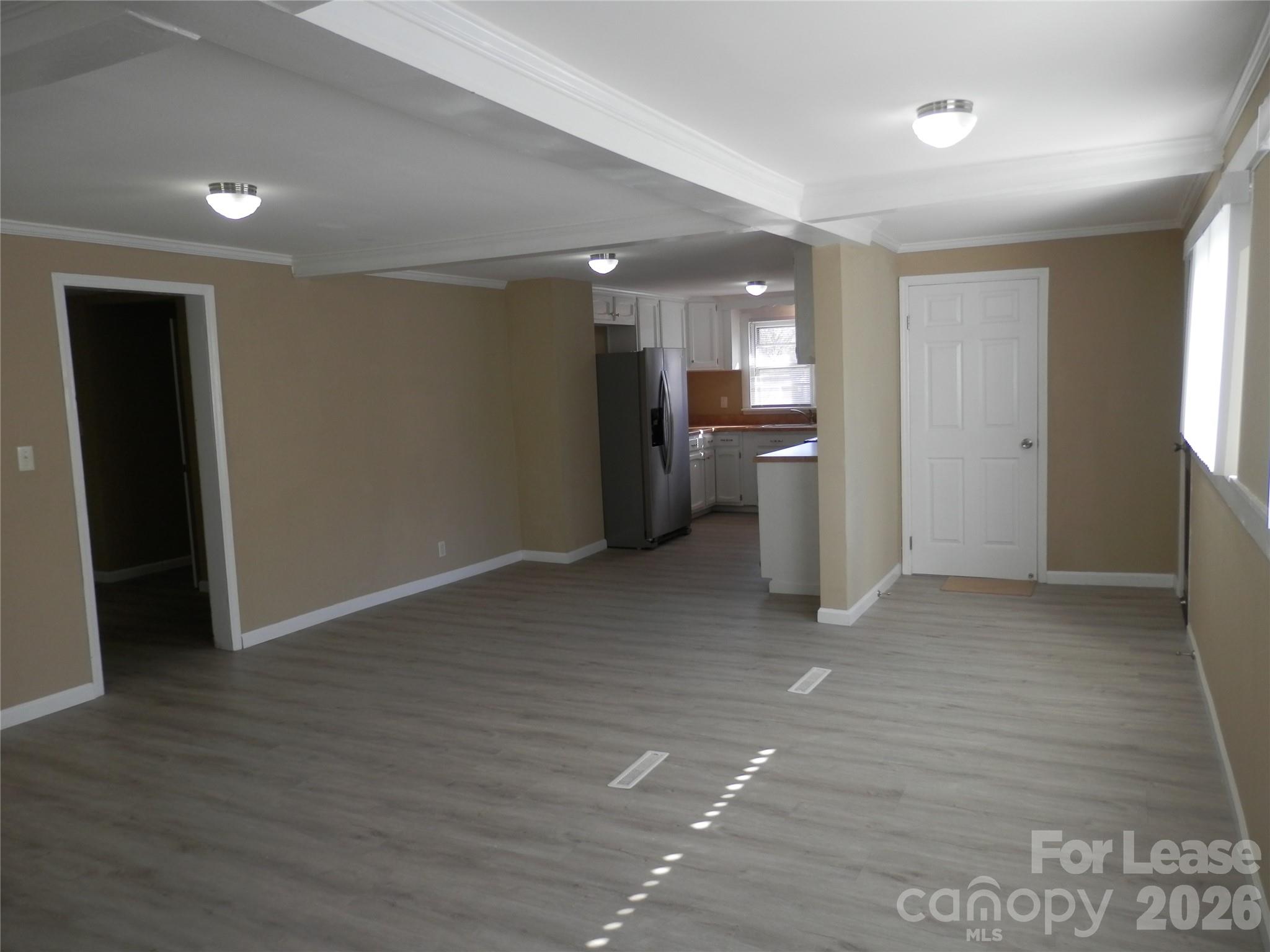 67 Barber Street Northwest Concord, NC 28027 - Photo 18 of 27 a view of a kitchen with a sink and a refrigerator