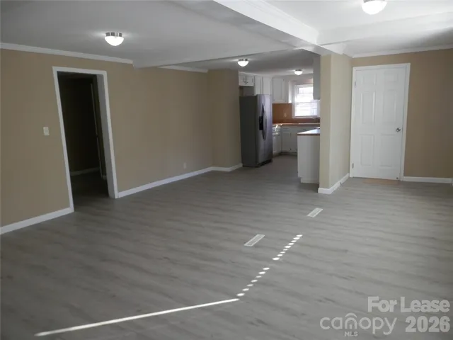 a kitchen with a refrigerator and a sink