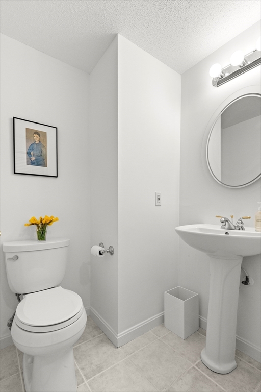 7 Carriage Way Danvers, MA 01923 - Photo 11 of 31 a bathroom with a toilet a sink and mirror