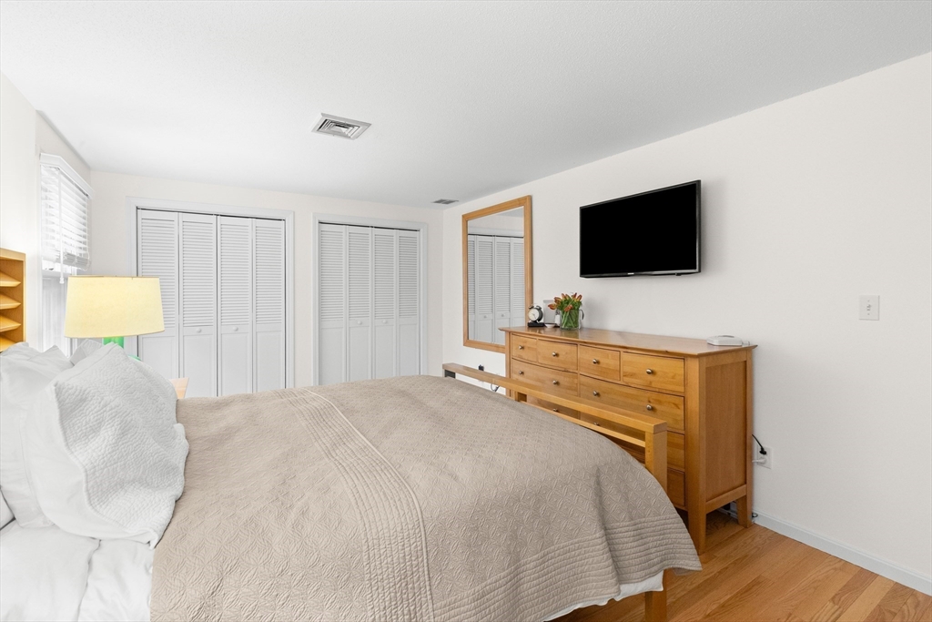 7 Carriage Way Danvers, MA 01923 - Photo 13 of 31 a bedroom with a bed and a flat screen tv