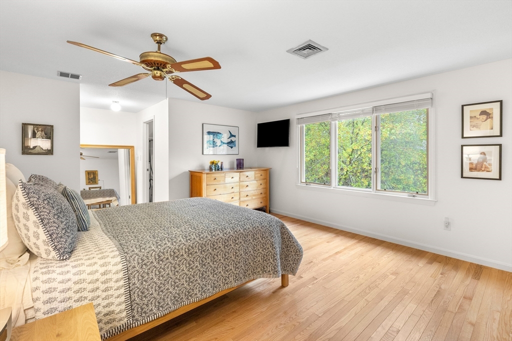 7 Carriage Way Danvers, MA 01923 - Photo 16 of 31 a bedroom with a bed dresser and a window