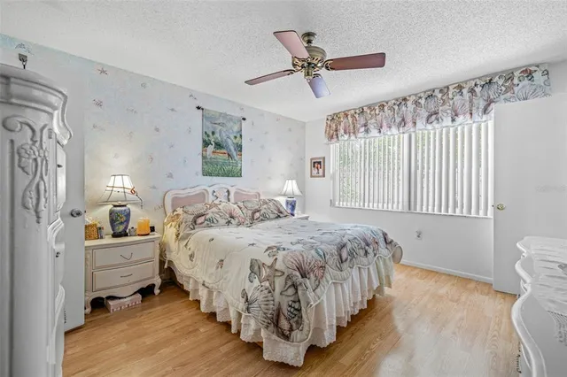 a bedroom with bed and window