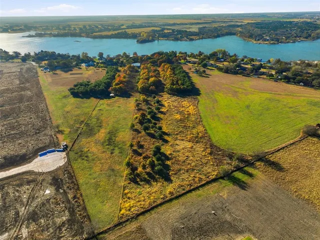 an aerial view of lake residential house with outdoor space