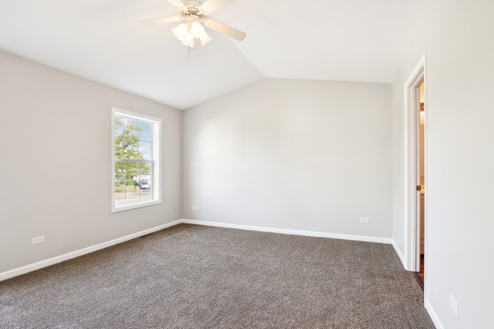 346 Richfield Trail Romeoville, IL 60446 - Photo 17 of 32 a view of an empty room with a window