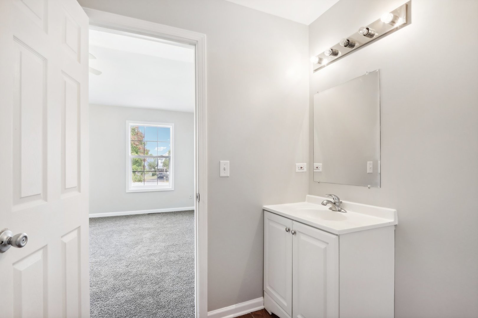 346 Richfield Trail Romeoville, IL 60446 - Photo 19 of 32 a bathroom with a sink and a mirror