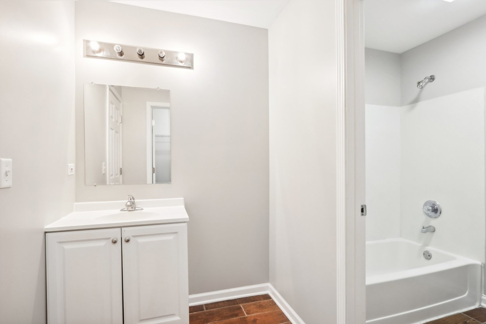 346 Richfield Trail Romeoville, IL 60446 - Photo 20 of 32 a bathroom with a sink a vanity and a mirror