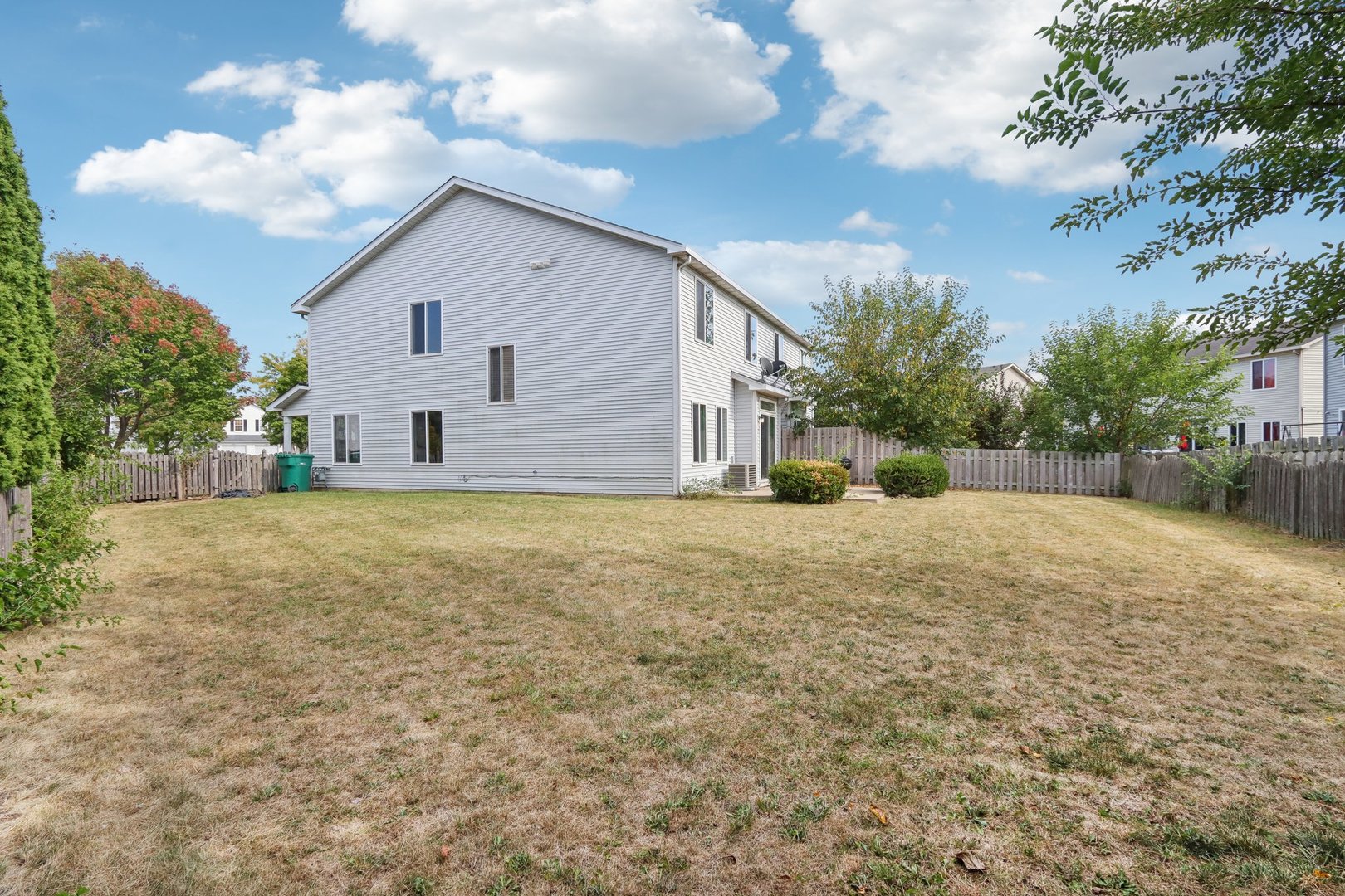 346 Richfield Trail Romeoville, IL 60446 - Photo 31 of 32 a view of a white house with a yard