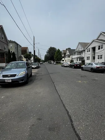 a car parked in a parking lot at street side