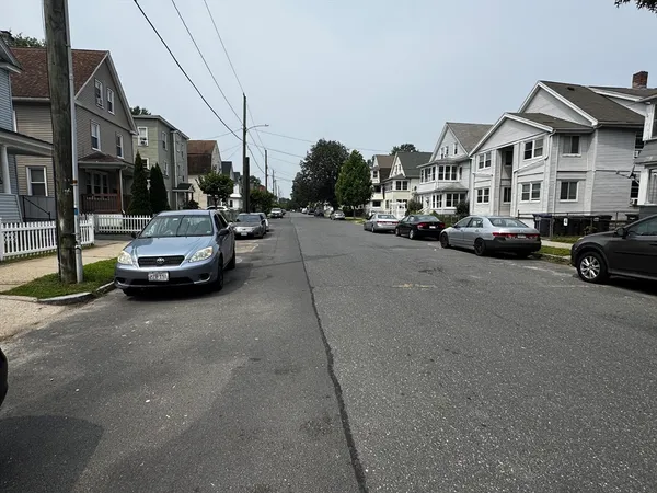 a view of a street in back of a building