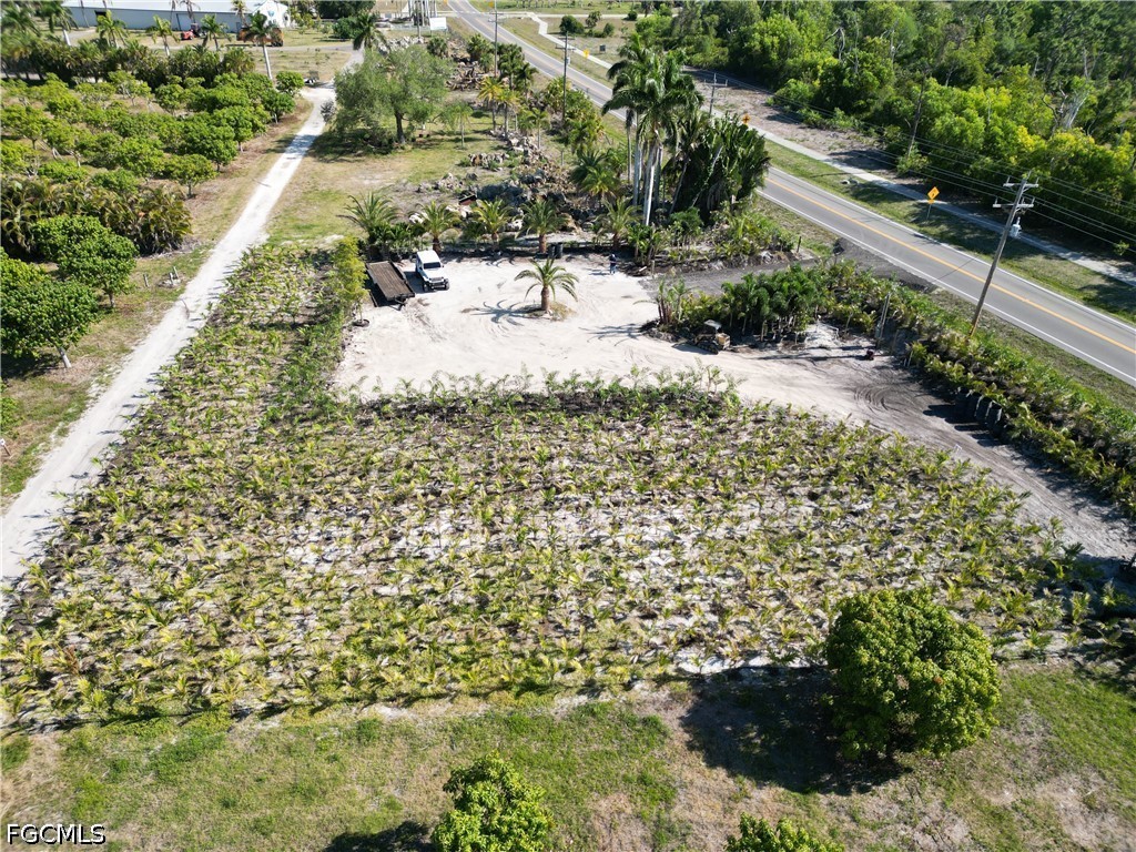 11851 Stringfellow Road Bokeelia, FL 33922 - Photo 13 of 26 a view of a yard with an outdoor space