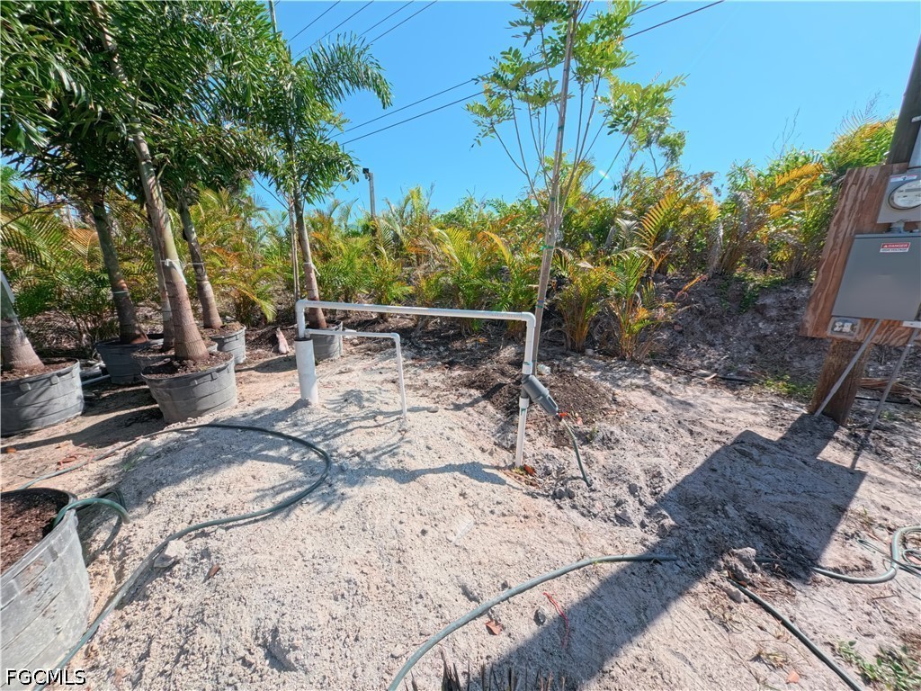 11851 Stringfellow Road Bokeelia, FL 33922 - Photo 22 of 26 a view of outdoor space yard and patio