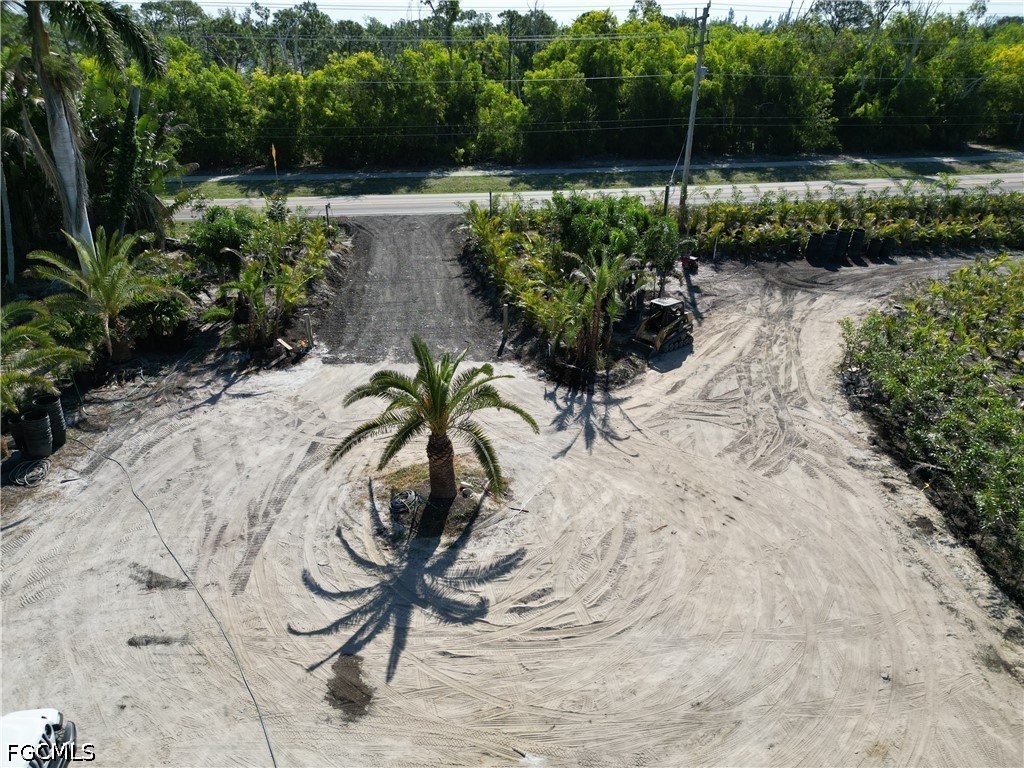11851 Stringfellow Road Bokeelia, FL 33922 - Photo 7 of 26 a view of a backyard with plants and lake view