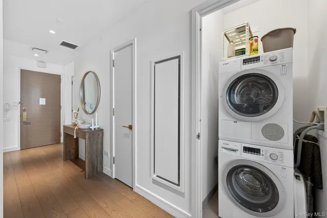 a view of a hallway with washer and dryer