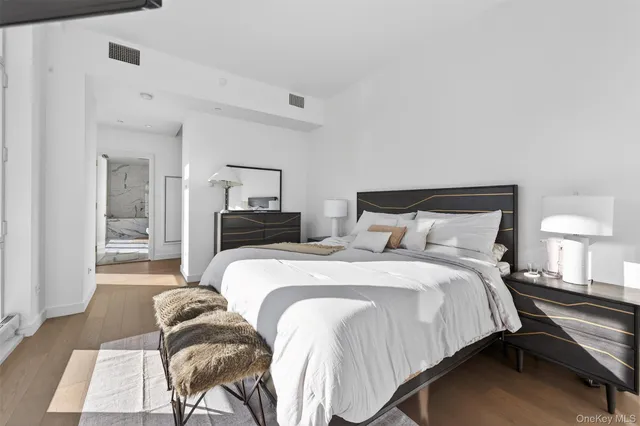 a bedroom with a bed and a couch