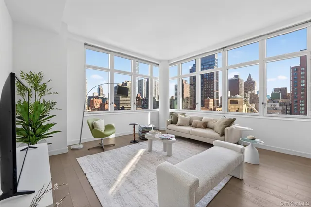 a living room with furniture and a large window