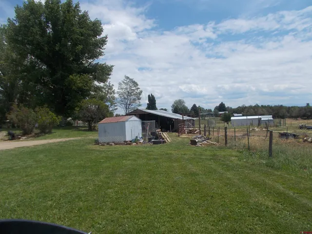 a backyard of a house with lots of green space