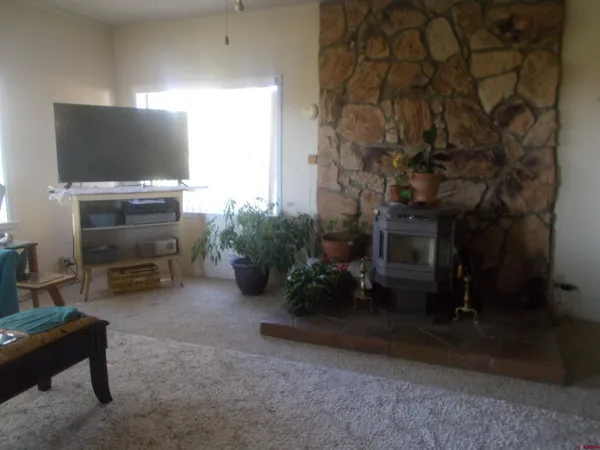 a kitchen with white cabinets and appliances