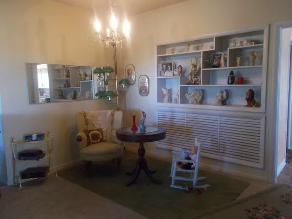 a bedroom with a bed and a chair