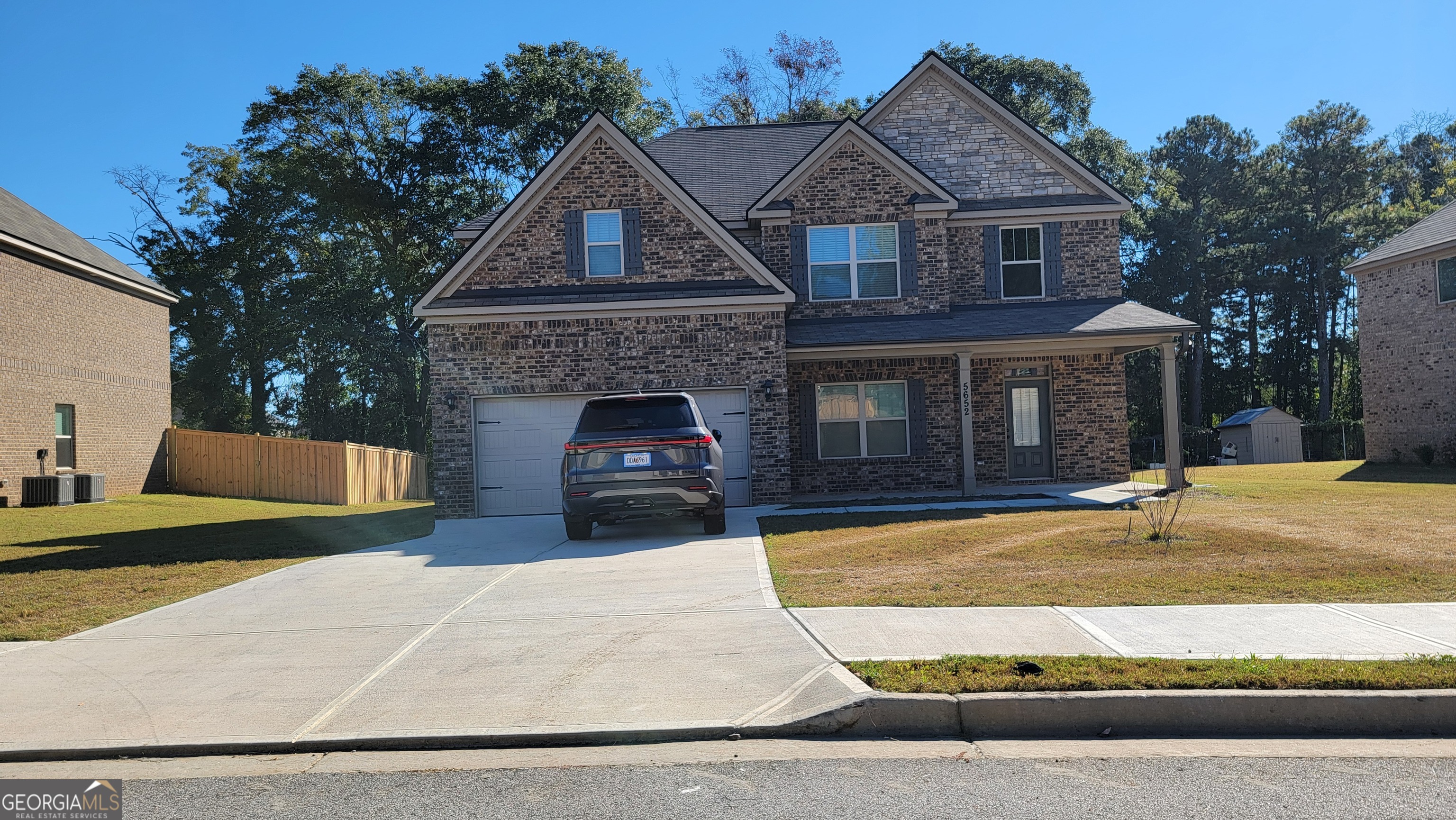 a front view of a house with yard