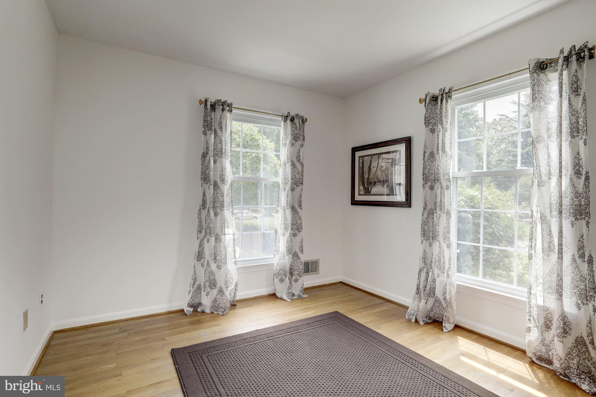 10239 Gainsborough Road Potomac, MD 20854 - Photo 4 of 21 an empty room with windows