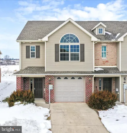 a front view of a house with yard