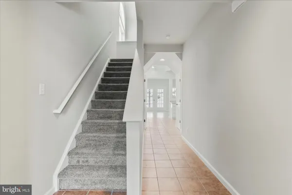 a view of a hallway with staircase