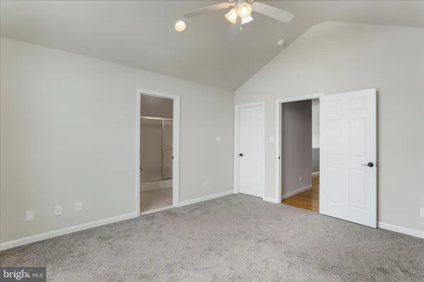 a bathroom with a granite countertop sink a mirror and a shower