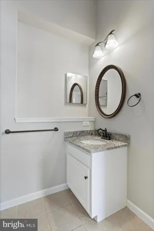 a small walk in closet with a window