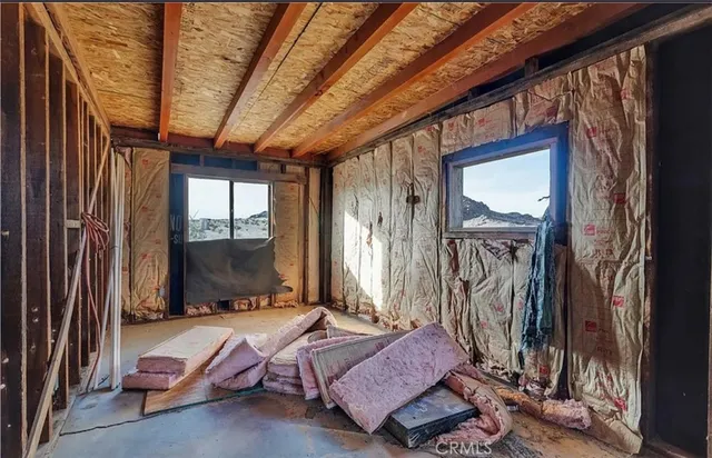 a living room with a couch next to a window