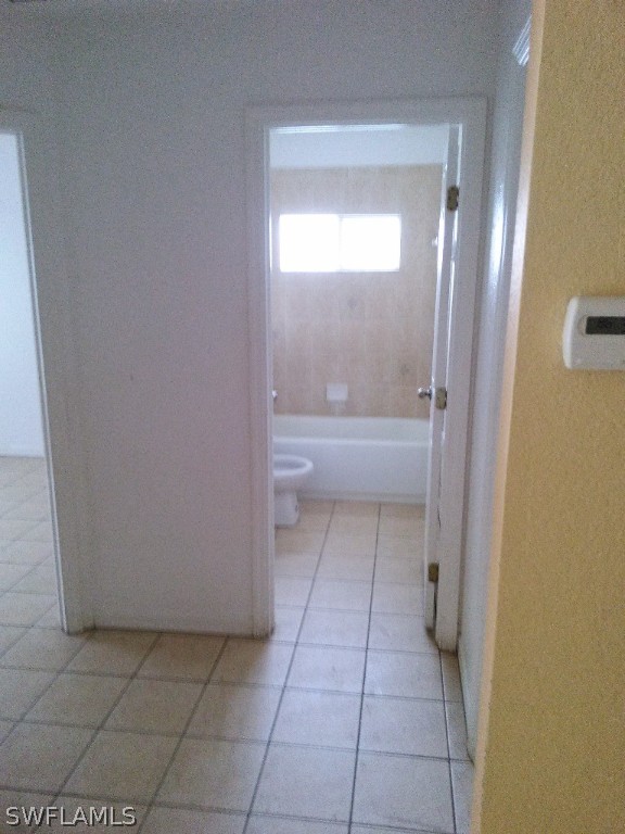 4533 26th Street Southwest Lehigh Acres, FL 33973 - Photo 5 of 10 a bathroom with a bathtub and a shower