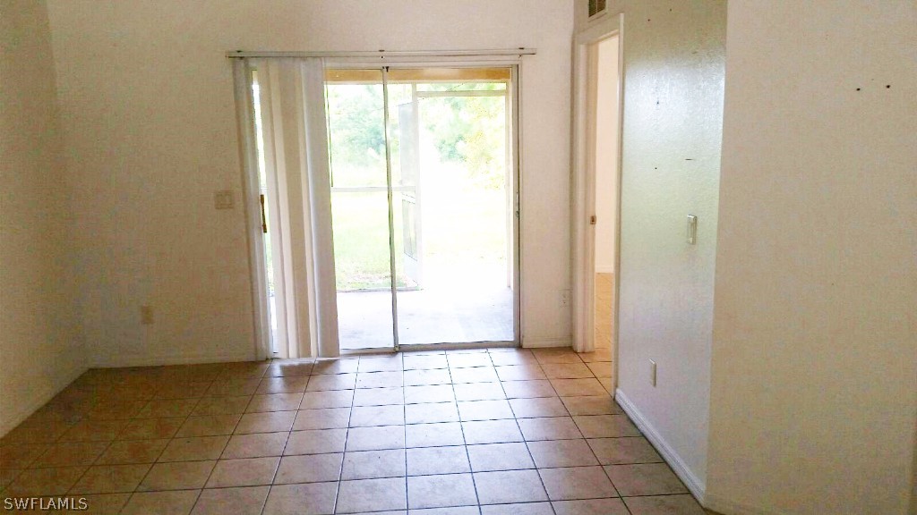 4533 26th Street Southwest Lehigh Acres, FL 33973 - Photo 9 of 10 a view of an empty room and window