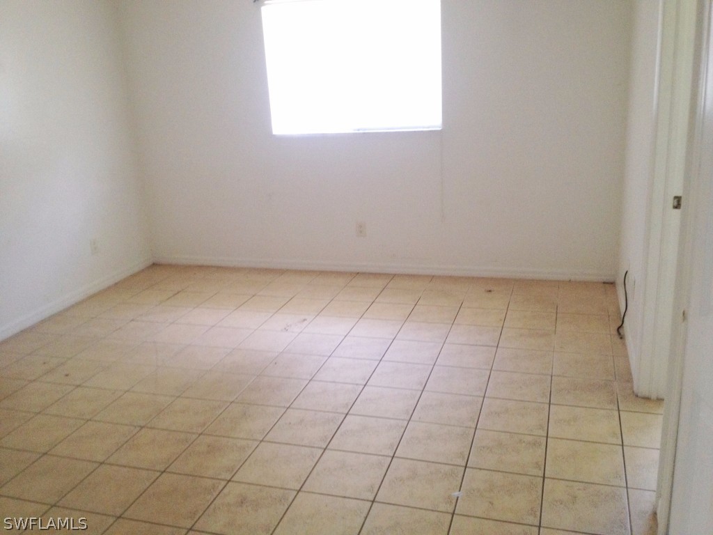 4533 26th Street Southwest Lehigh Acres, FL 33973 - Photo 10 of 10 a view of an empty room and window