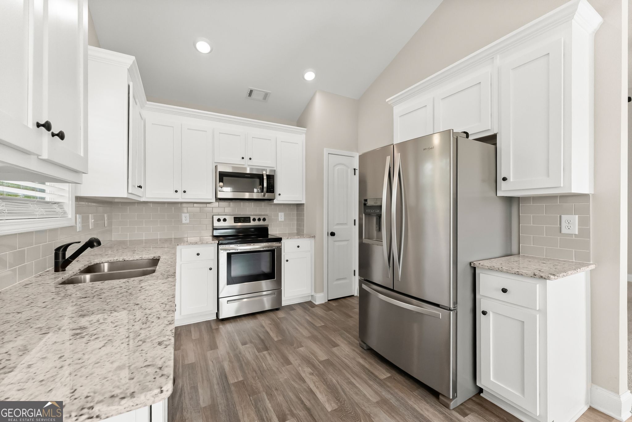 810 Anderson Thomas Road Martin, GA 30557 - Photo 13 of 40 a kitchen with stainless steel appliances a refrigerator sink and microwave
