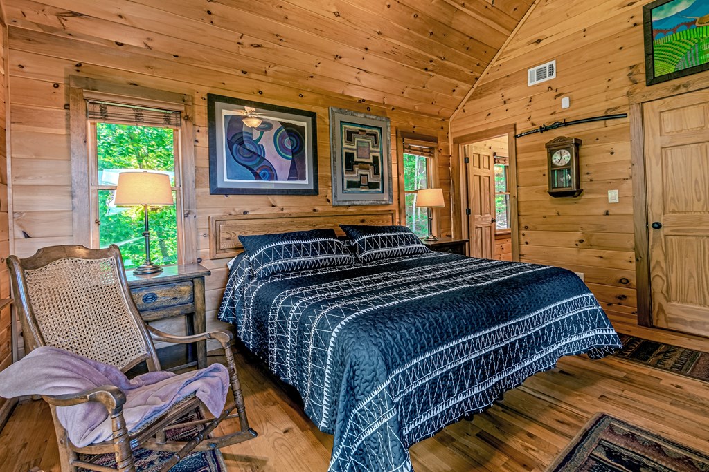83 Carey Lane Blue Ridge, GA 30513 - Photo 24 of 73 a bedroom with bed and wooden floor
