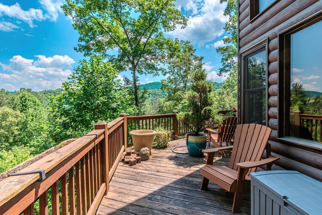 83 Carey Lane Blue Ridge, GA 30513 - Photo 60 of 73 a view of balcony with wooden floor and outdoor seating