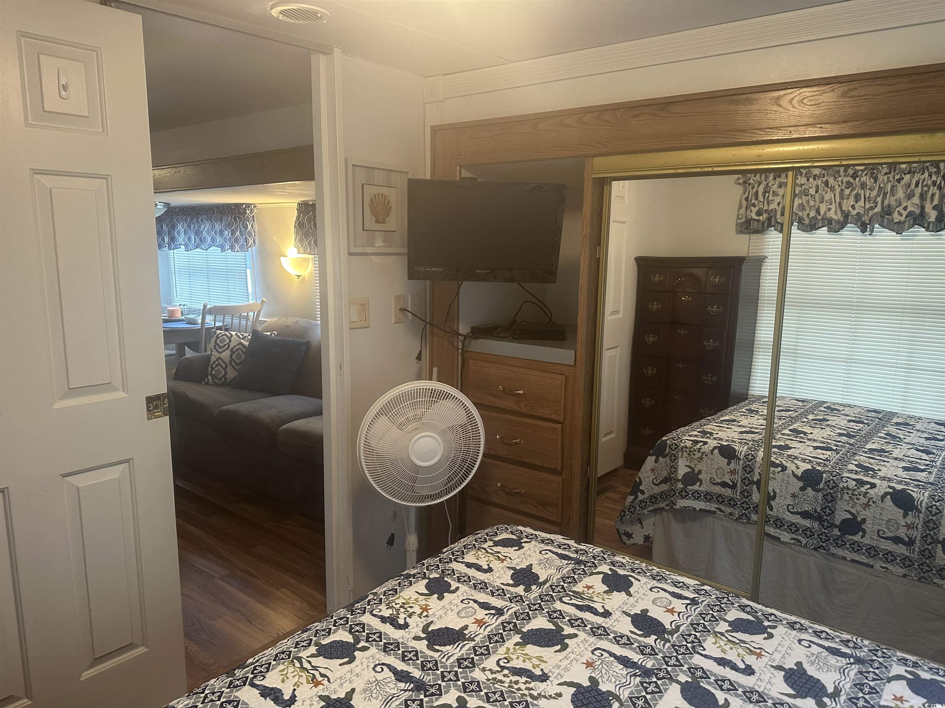 613-431 5th Avenue South Myrtle Beach, SC 29577 - Photo 12 of 36 Bedroom featuring a closet and wood finished floors