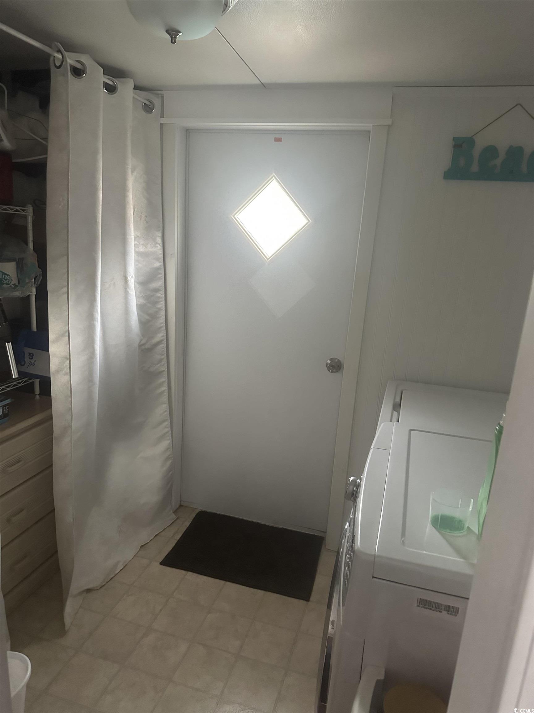 613-431 5th Avenue South Myrtle Beach, SC 29577 - Photo 16 of 36 Washroom with washer and clothes dryer