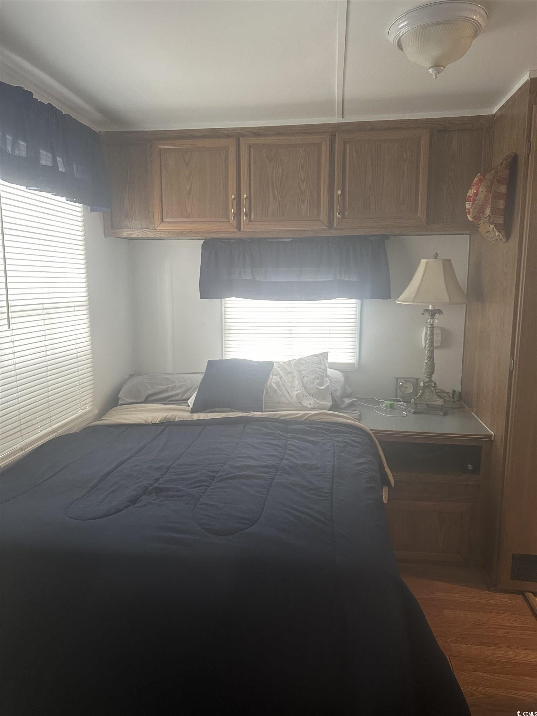 613-431 5th Avenue South Myrtle Beach, SC 29577 - Photo 18 of 36 Bedroom featuring multiple windows