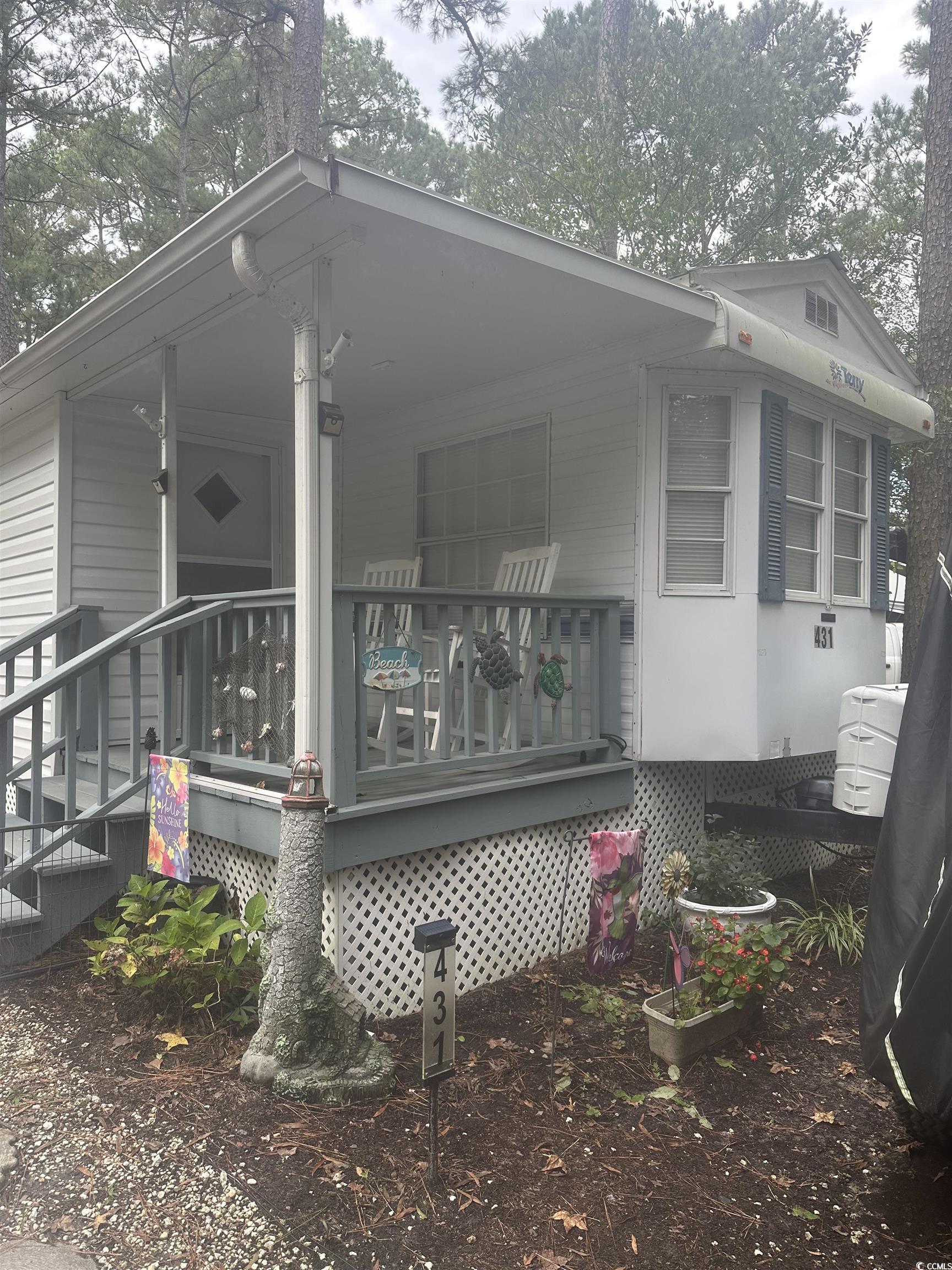 613-431 5th Avenue South Myrtle Beach, SC 29577 - Photo 21 of 36 View of side of property featuring a wooden deck