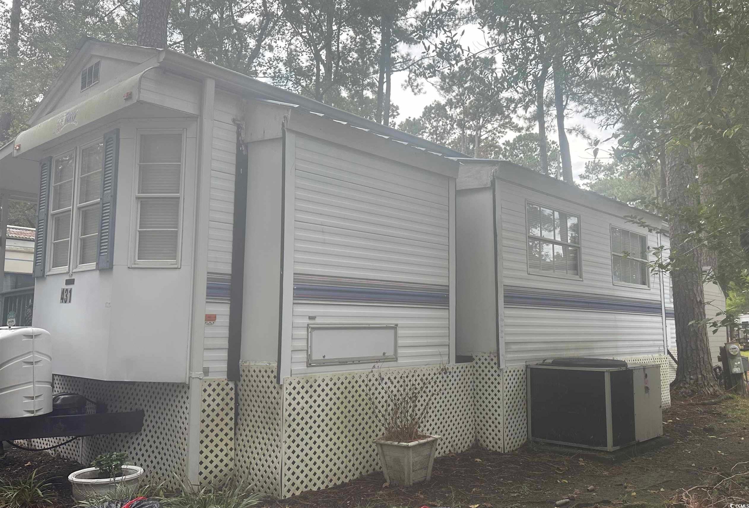 613-431 5th Avenue South Myrtle Beach, SC 29577 - Photo 23 of 36 View of side of property featuring a central air condition unit