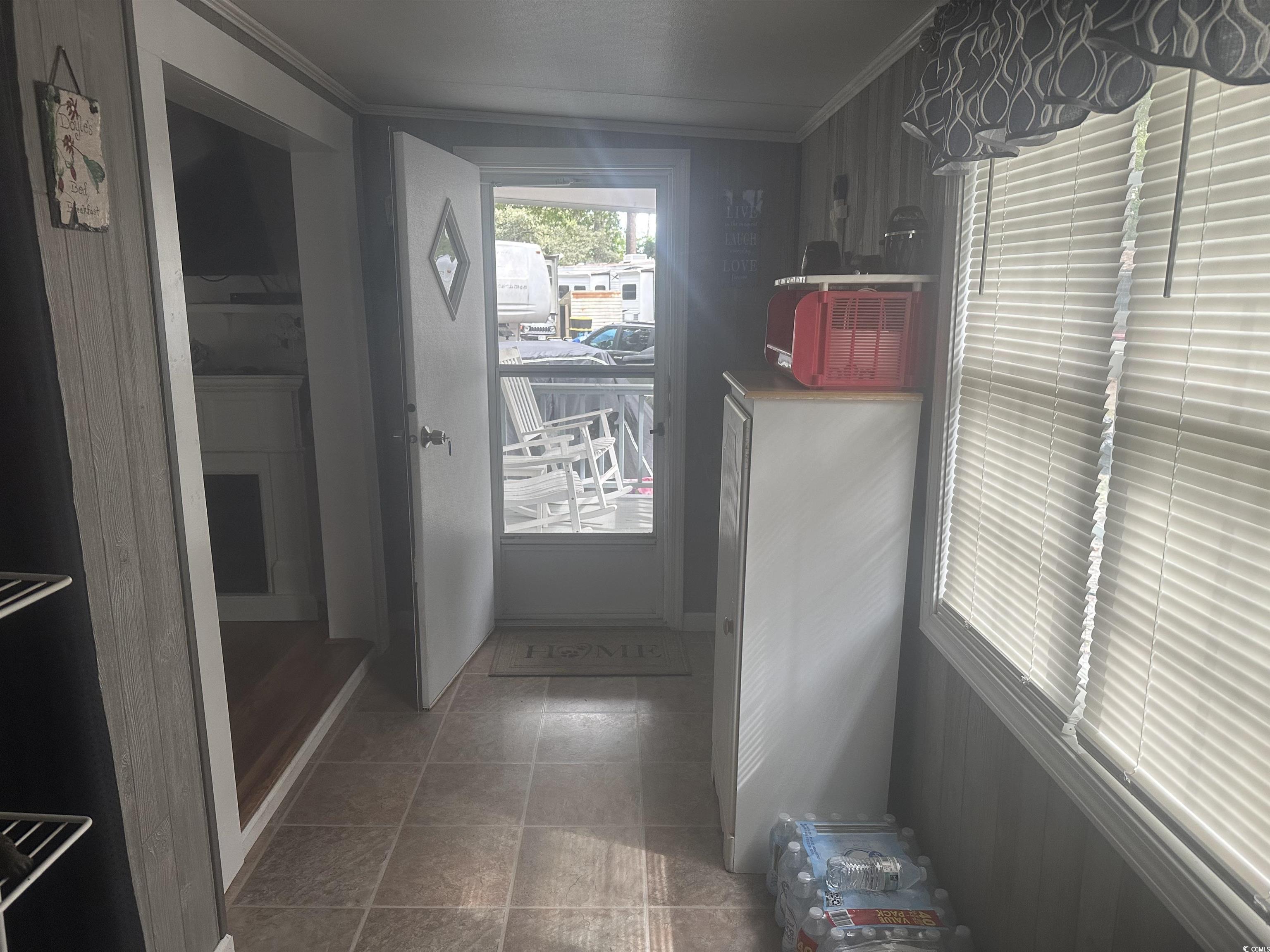 613-431 5th Avenue South Myrtle Beach, SC 29577 - Photo 7 of 36 Doorway to outside with ornamental molding