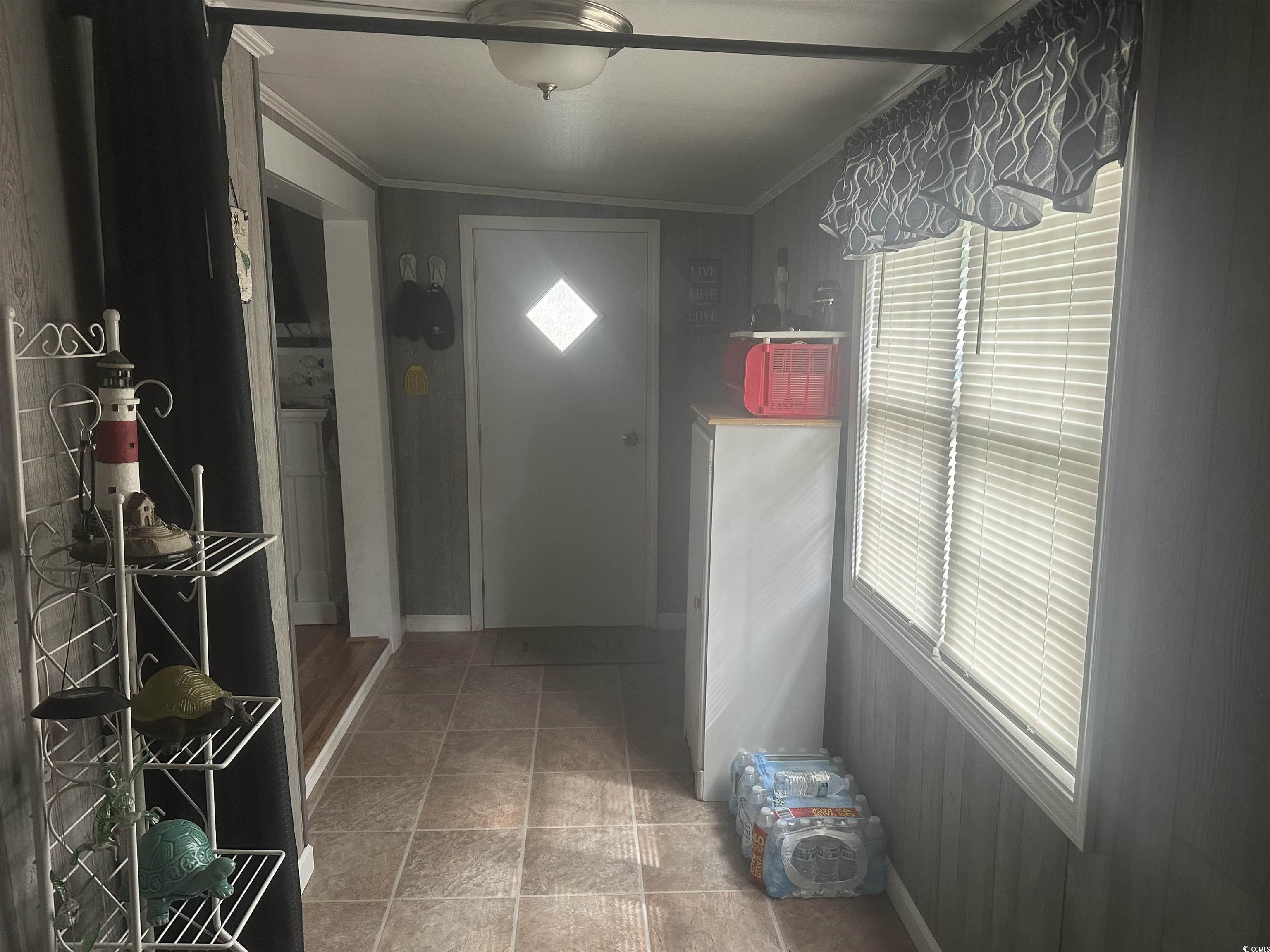 613-431 5th Avenue South Myrtle Beach, SC 29577 - Photo 8 of 36 Doorway featuring crown molding and baseboards