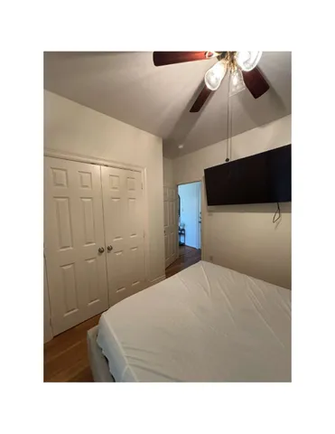 a room with a bed and glass wall