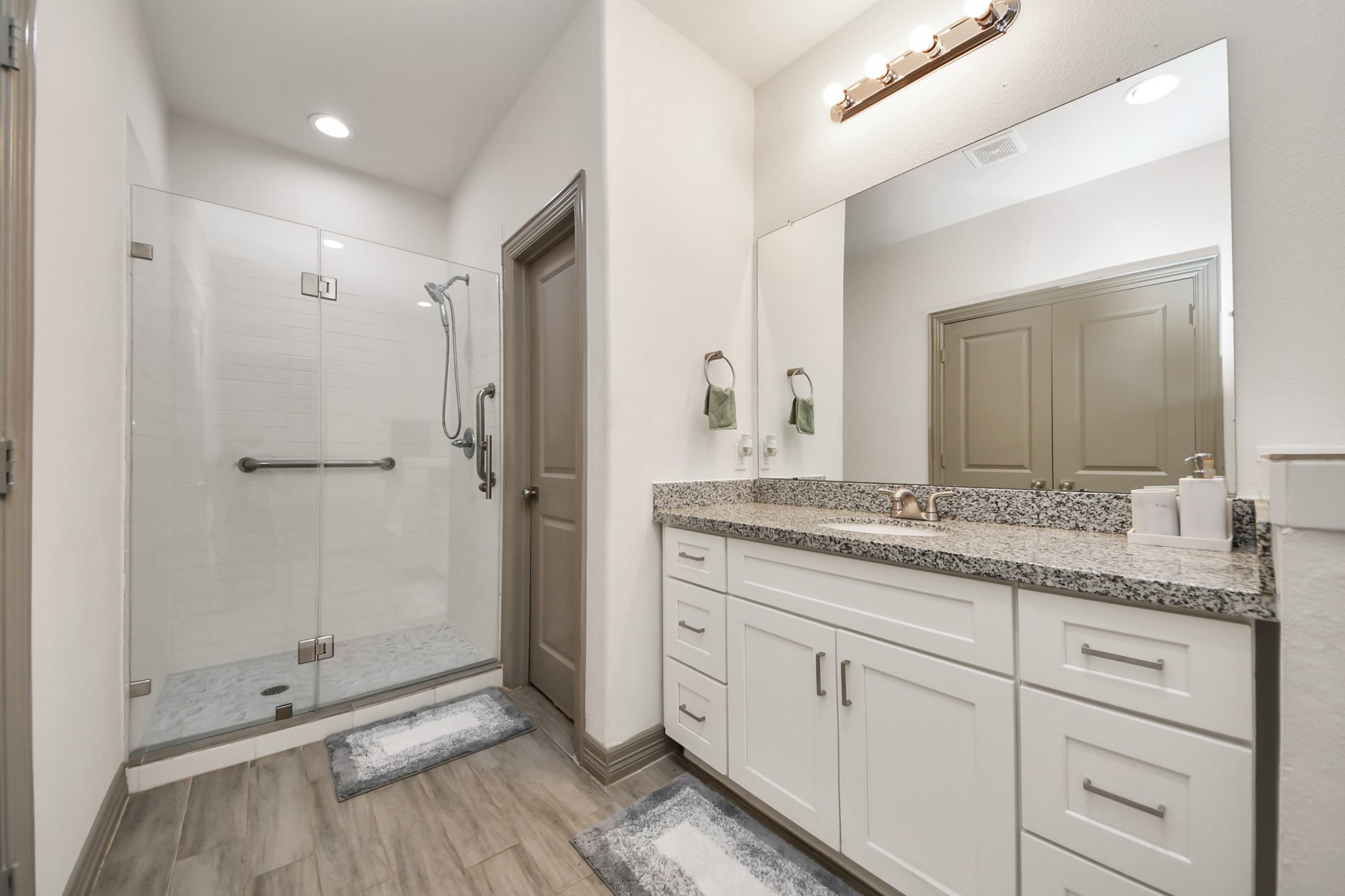 5334 Pershing Street Houston, TX 77033 - Photo 7 of 43 a bathroom with a granite countertop sink mirror and double