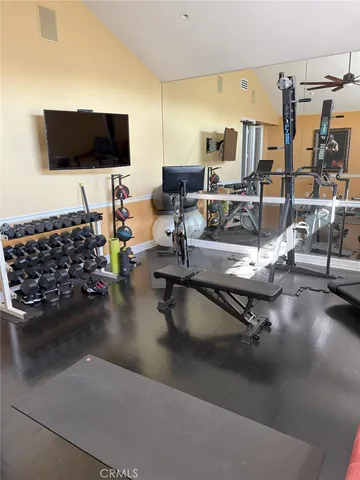 a living room with lots of furniture and a flat screen tv