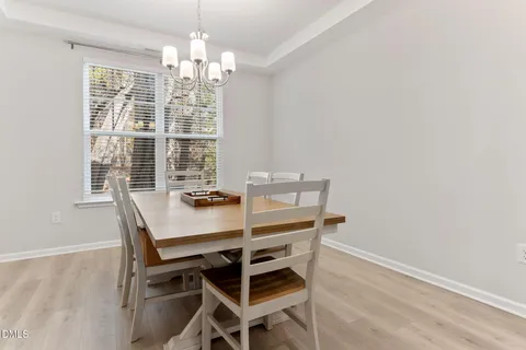 a kitchen with white cabinets and appliances