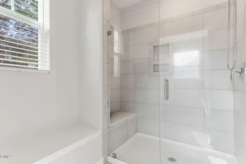 a bathroom with a double vanity sink a toilet and a mirror