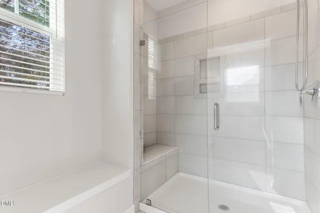 a bathroom with a double vanity sink a toilet and a mirror