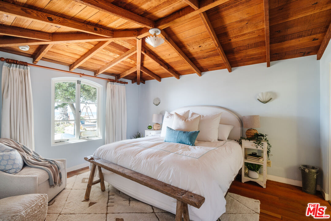 35145 Beach Road Dana Point, CA 92624 - Photo 28 of 57 a bedroom with a bed and a window