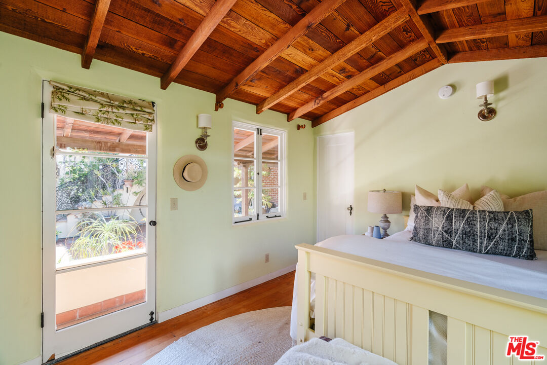 35145 Beach Road Dana Point, CA 92624 - Photo 30 of 57 a bedroom with a bed and a large window